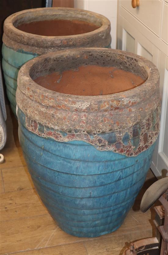 A pair of Atlantis glazed earthenware garden planters H.65cm